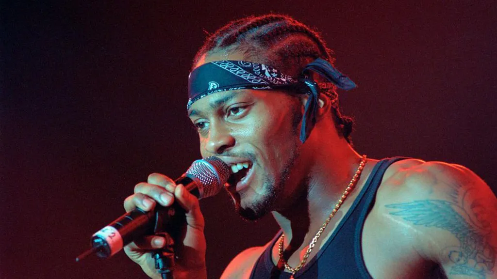 D'Angelo singing to a microphone on stage